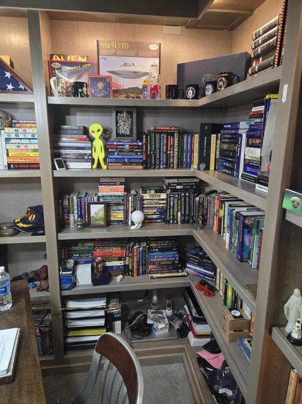 Jim Semivan's man cave includes his extensive library and alien keeping watch.